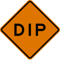 Dip road sign (MUTCD CW8-2)
