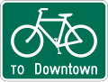 Bike route with destination road sign (MUTCD D11-1c)