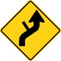 Reverse curve with side road (right) road sign (MUTCD W1-10dR)