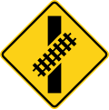 Skewed crossing ahead (right) (this supplements the W10-1 sign but does not replace it) road sign (MUTCD W10-12L)