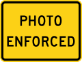 Photo enforced road sign (MUTCD W16-10aP)