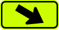 Downward diagonal arrow to the right (plaque) road sign (MUTCD W16-7PR_(fluorescent))