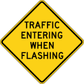 Traffic Entering When Flashing road sign (MUTCD W2-10)