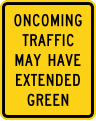 Oncoming traffic may have extended green road sign (MUTCD W25-2)