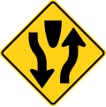 Divided highway begins road sign (MUTCD W6-1)