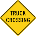 Truck crossing road sign (MUTCD W8-6)