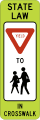 In-street school crossing road sign (MUTCD R1-6b)