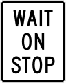 Wait on stop road sign (MUTCD R1-7)