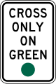 Cross only on green road sign (MUTCD R10-1)