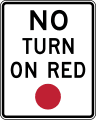 No turn on circular red road sign (MUTCD R10-11)