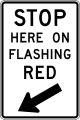 Stop here on flashing red road sign (MUTCD R10-14b)