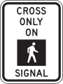 Cross only on pedestrian signal road sign (MUTCD R10-2)