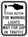 Push button for warning lights - wait for gap in traffic road sign (MUTCD R10-25)