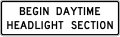 Begin daytime headlight section road sign (MUTCD R16-10)