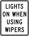 Lights on when using wipers road sign (MUTCD R16-5)