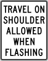 Travel on shoulder allowed when flashing road sign (MUTCD R3-51d)