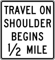 Travel on shoulder begins (distance) road sign (MUTCD R3-52c)