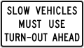 Slow vehicles must use turn-out ahead road sign (MUTCD R4-13)
