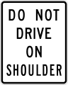 Do not drive on shoulder road sign (MUTCD R4-17)