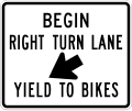 Begin right turn lane yield to bikes road sign (MUTCD R4-4)