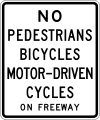 No pedestrians, bicycles or motor-driven cycles on freeway road sign (MUTCD R5-10a)