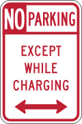 No parking, except while charging road sign (MUTCD R7-113)