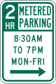 Two hour metered parking (times and days) road sign (MUTCD R7-21)