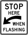 Stop here when flashing (alternative) road sign (MUTCD R8-10a)