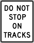 Do not stop on tracks road sign (MUTCD R8-8)