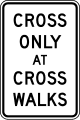 Cross only at cross walks road sign (MUTCD R9-2)