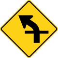 Curve with crossroad (left) road sign (MUTCD W1-10aL)