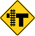 T intersection with parallel tracks (left) road sign (MUTCD W10-4L)