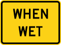 When wet (plaque) road sign (MUTCD W8-5P)
