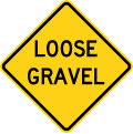 Loose gravel road sign (MUTCD W8-7)